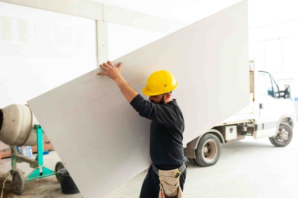 worker-builds-a-plasterboard-wall-2023-11-27-05-31-08-utc(1)